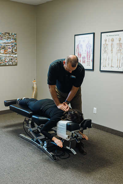 Dr. Carter at InMotion chiropractic Buffalo Minnesota performing a neck adjustment